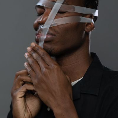 Close-up of hands in a meditative gesture.