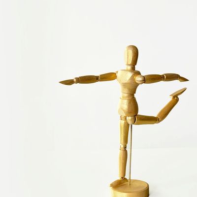 Person in a fluid yoga pose, showing movement.